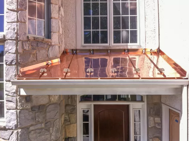 A house with a copper standing seam roof.