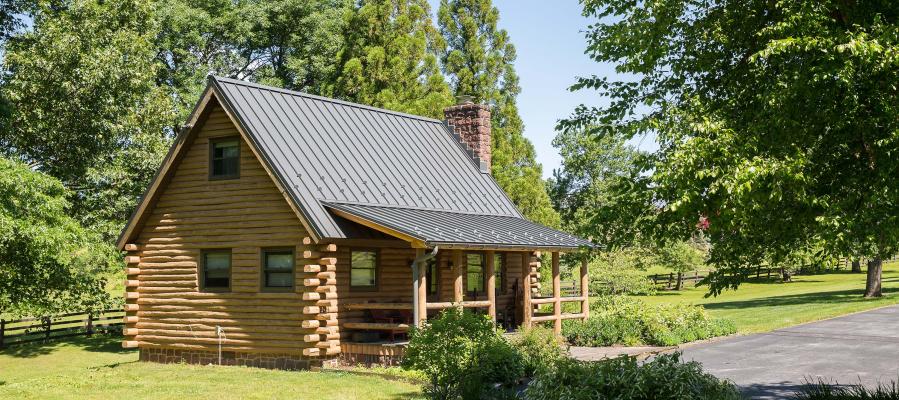 Log home with a metal standing seam roof